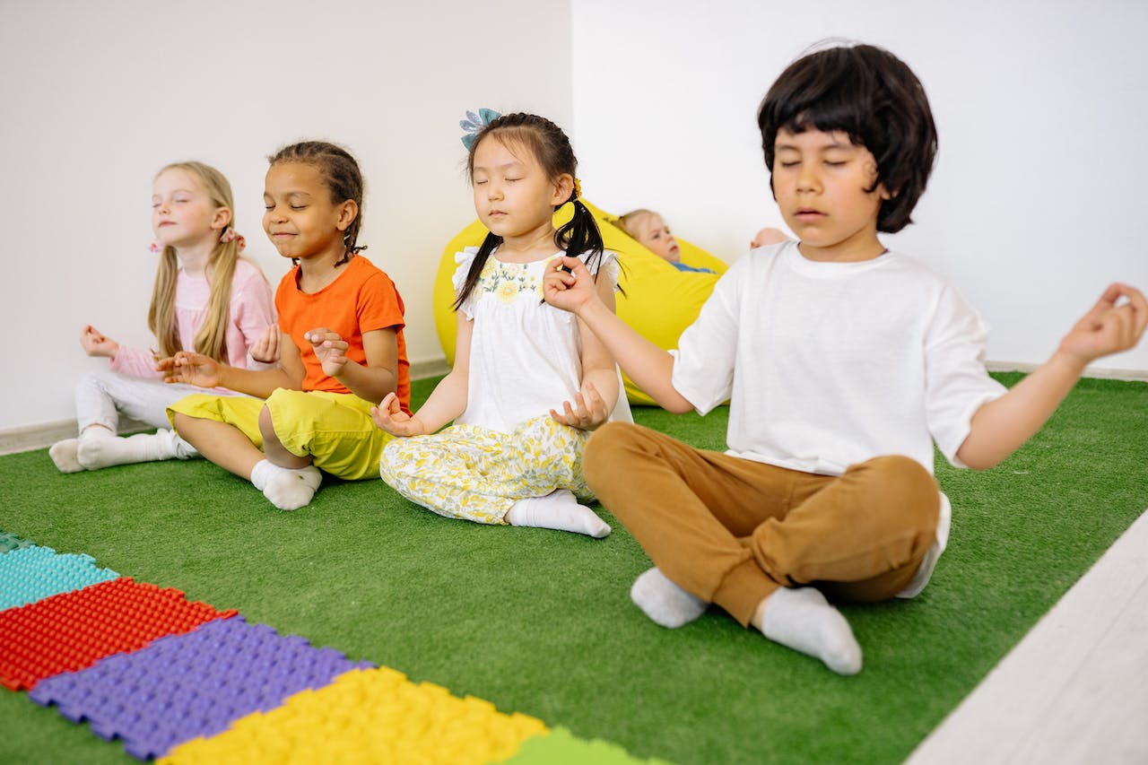 therapeutic yoga for children; children posed for yoga